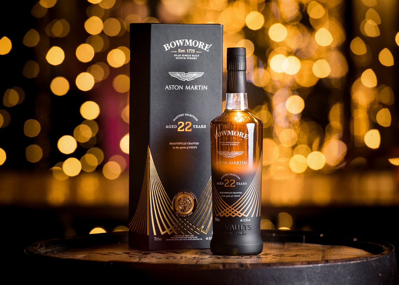 Photo of Bowmore Aston Martin 22 year Old Bottle with it's box, with bokeh lighting background
