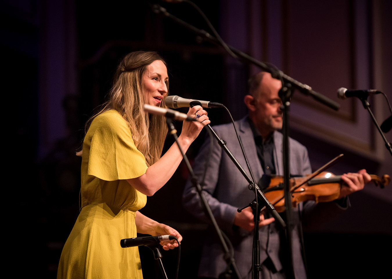 Singer, Julie Fowlis, performing on stage at the opening event of an Edinburgh business conference.