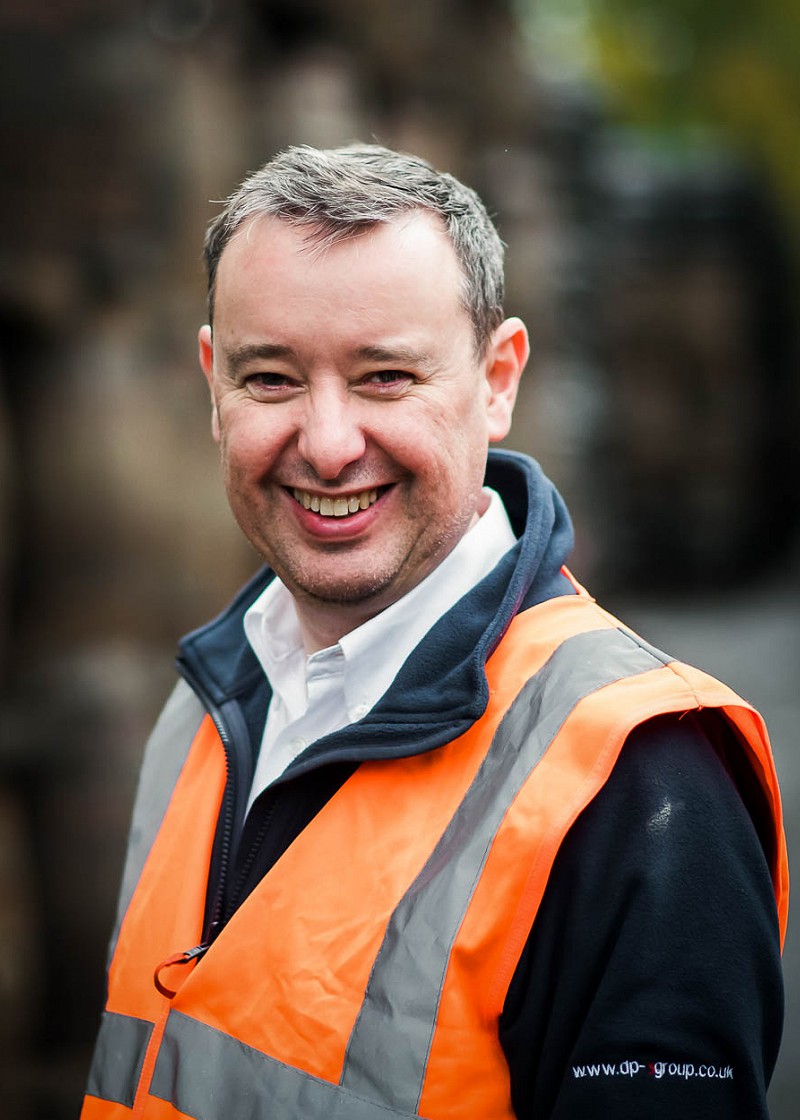 Business owner portrait in high-vis while on site