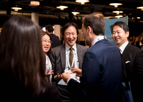 Delegates networking at a business conference